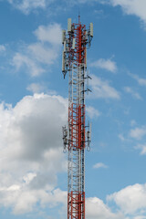 Antenna repeater tower on blue sky.