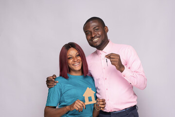 happy african couple buying a house concept