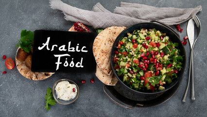Fresh Tabbouleh salad on dark background.