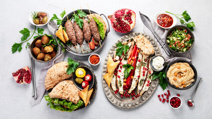 Lebanese food assortment on light background.