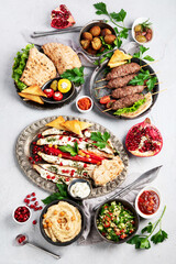 Lebanese food assortment on light background.