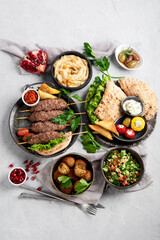 Lebanese food assortment on light background.