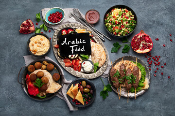 Arabic food assortment on dark background.