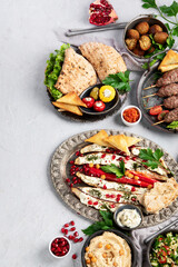 Lebanese food assortment on light background.