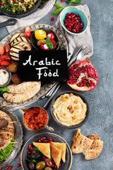 Arabic food assortment on dark background.