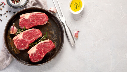Grilled fish, seafood and meat assortment on light background.