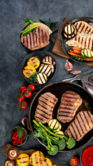 Grilled barbecue meat assortment on dark background.