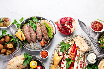 Lebanese food assortment on light background.