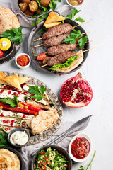 Lebanese food assortment on light background.