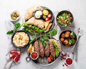 Lebanese food assortment on light background.