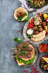 Arabic food assortment on dark background.