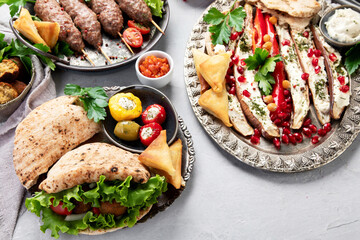 Lebanese food assortment on light background.