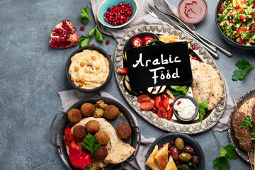 Arabic food assortment on dark background.