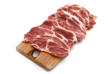 Raw pork sliced meat on wooden board on white background. Heap of pieces raw pork isolated on white background. Butchery, market, shop