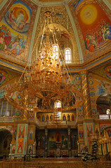 Fototapeta na wymiar Pochayiv, Ukraine - interior decoration of the cathedral in the Pochaev Lavra. Interior of Holy Dormition Pochayiv Lavra, Ukraine. May 2021