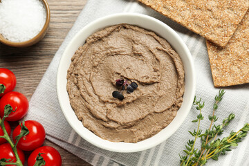Flat lay composition with tasty liver pate on wooden table