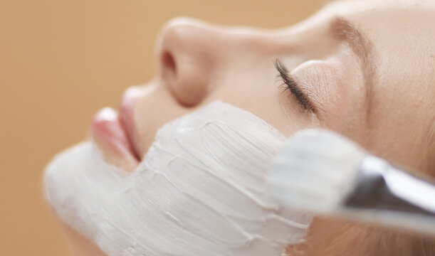 Spa facial mask application. Spa beauty organic facial mask application at day spa salon.