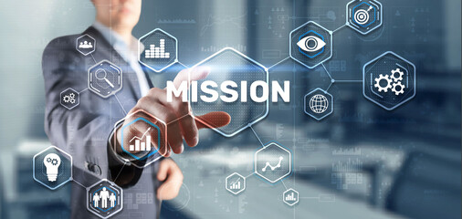 Businessman clicks on virtual screen Mission