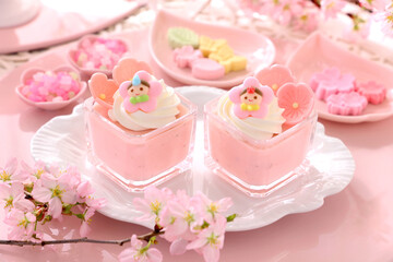 Cherry blossom mousse dessert with whipped cream in glasses. Home made spring glass dessert for Japanese Doll's Festival . おひな祭り　ひな祭り　さくらババロア　さくらプリン