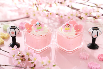 Cherry blossom mousse dessert with whipped cream in glasses. Home made spring glass dessert for Japanese Doll's Festival . おひな祭り　ひな祭り　さくらババロア　さくらプリン