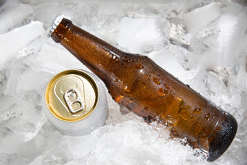 beer bottle with beer can  chilled in ice