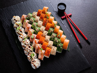 tasty sushi on the black background