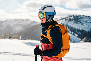 Mountaineer backcountry ski walking ski woman alpinist in the mountains. Ski touring in alpine...