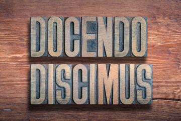 Docendo discimus wood