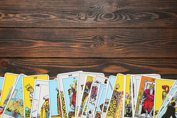 Tarot cards on wooden table, top view. Space for text - obrazy, fototapety, plakaty