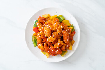 fried crispy chicken with sweet and sour sauce