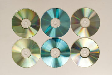 CD and DVD disk on white background. Technology from the 90s