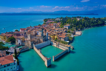 Sirmione aerial view. Top view, historic center of the Sirmione peninsula, lake garda. Aerial panorama of Sirmione. Lake Garda, Sirmione, Italy. Italian castle on Lake Garda. - obrazy, fototapety, plakaty