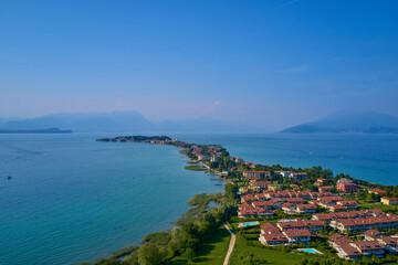 Rocca Scaligera Castle in Sirmione. Aerial view on Sirmione, Garda. Italy, Lombardy. Panoramic view at high altitude. Aerial photography with drone.