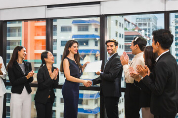 Employee gets a certificate of achievement, Businesspeople with certificate in the office, Businessman giving appreciation certificate to employee for achievement