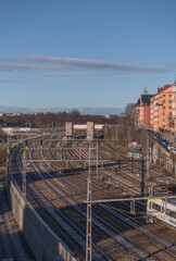 Train to Arlanda airport passing the rail tracks on its way to central station a winter day in Stockholm