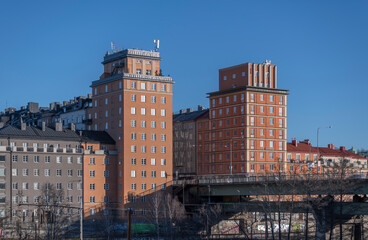Tower apartment buildings at the bridge St Eriksbron over the canal Karlbergskanalen a sunny winter day in Stockholm