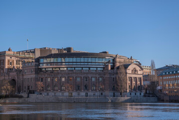 Facade of the government house with statues at the river Norrstr&ouml;m a sunny winter day in Stockholm