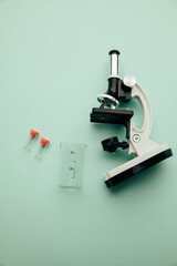 Microscope and flask on a blue background. Healthcare concept