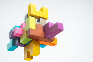 Abstract construction from wooden blocks. The concept of logical thinking.. - obrazy, fototapety, plakaty