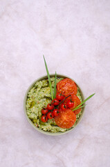 Spicy green mashed potatoes with fried tomatoes