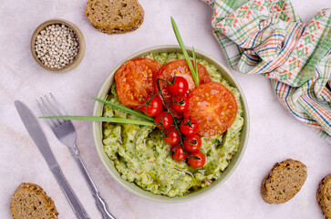 Spicy green mashed potatoes with fried tomatoes