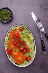 Spicy green mashed potatoes with fried tomatoes