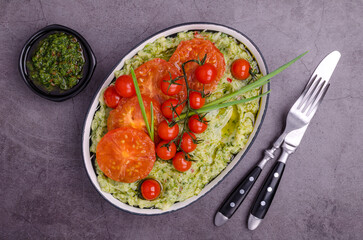 Spicy green mashed potatoes with fried tomatoes