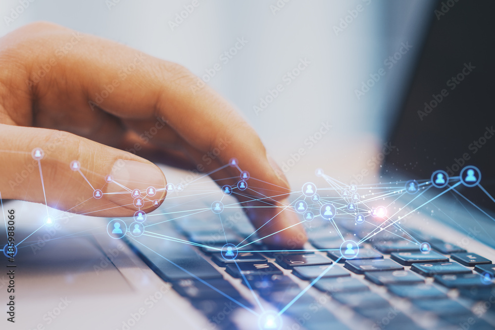 Poster Close up of hand at desktop using laptop with abstract glowing polygonal network with people icons. Blurry background. Online networking, multimedia, digital communication concept. Double exposure.
