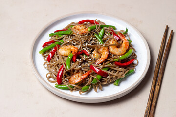 Soba noodles with shrimp, pepper and green beans. Japanese cuisine. Asian food.