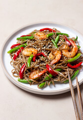 Soba noodles with shrimp, pepper and green beans. Japanese cuisine. Asian food.