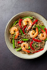 Soba noodles with shrimp, pepper and green beans. Japanese cuisine. Asian food.