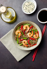 Soba noodles with shrimp, pepper and green beans. Japanese cuisine. Asian food.