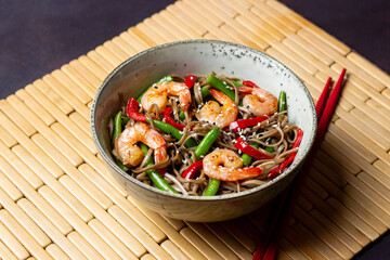 Soba noodles with shrimp, pepper and green beans. Japanese cuisine. Asian food.