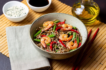 Soba noodles with shrimp, pepper and green beans. Japanese cuisine. Asian food.